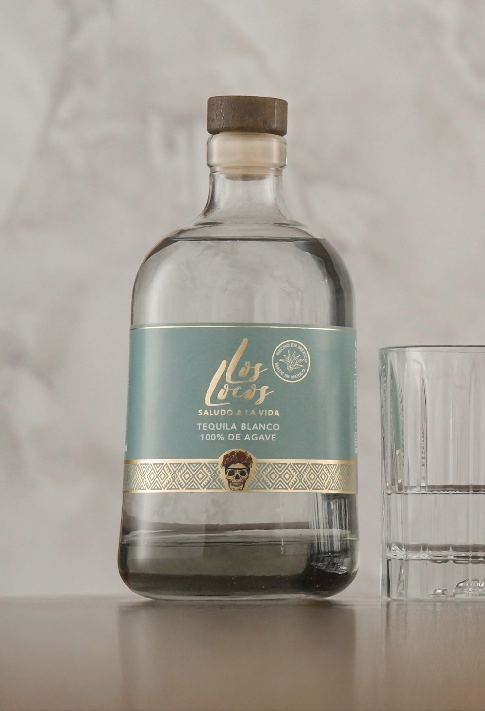 Los Locos Tequila Blanco bottle with a glass