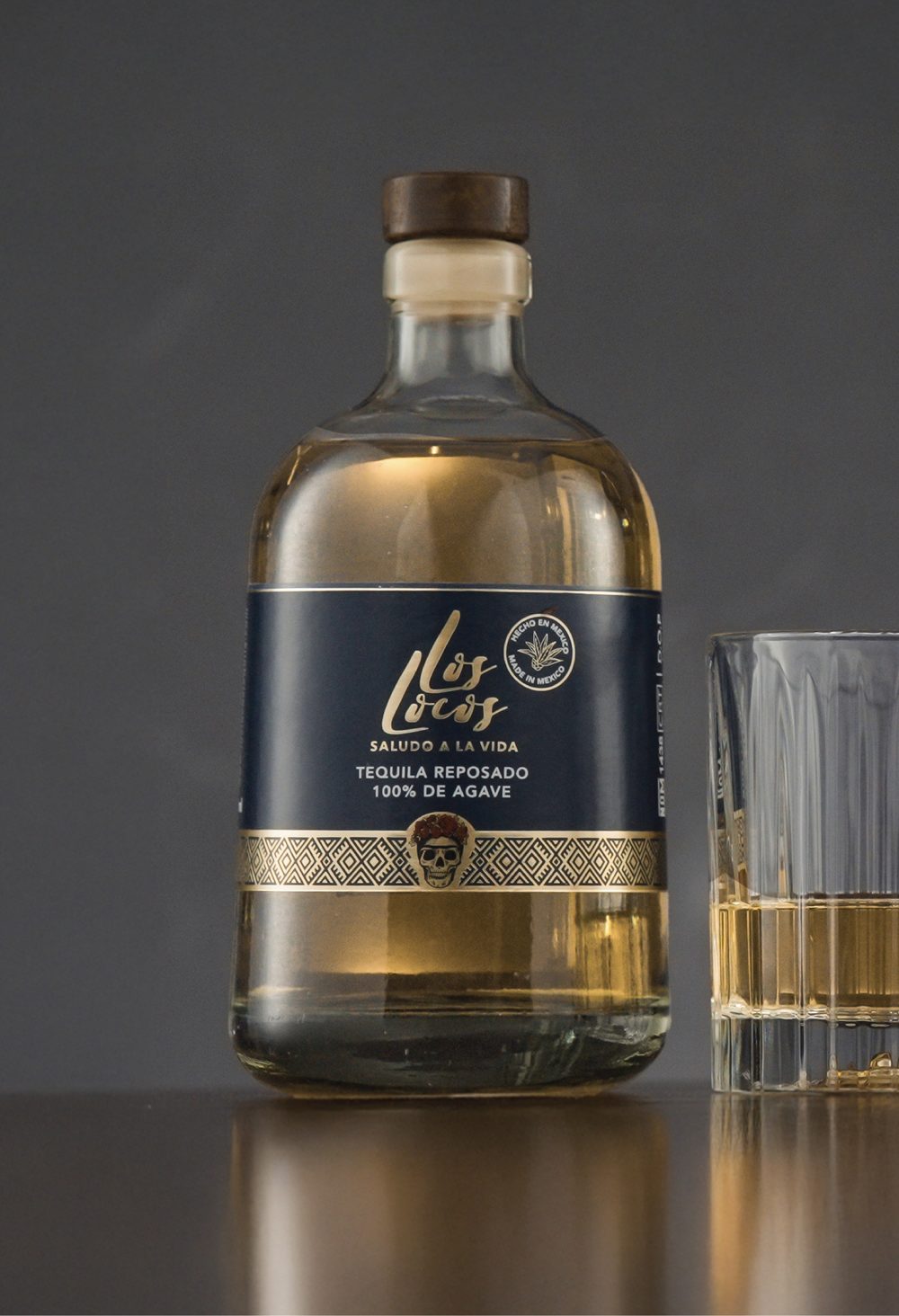 Los Locos Tequila Reposado bottle with a glass